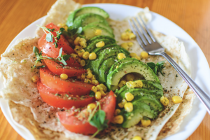 Image of healthy looking vegetables on a tortilla as part of a discussion of plant-based diets