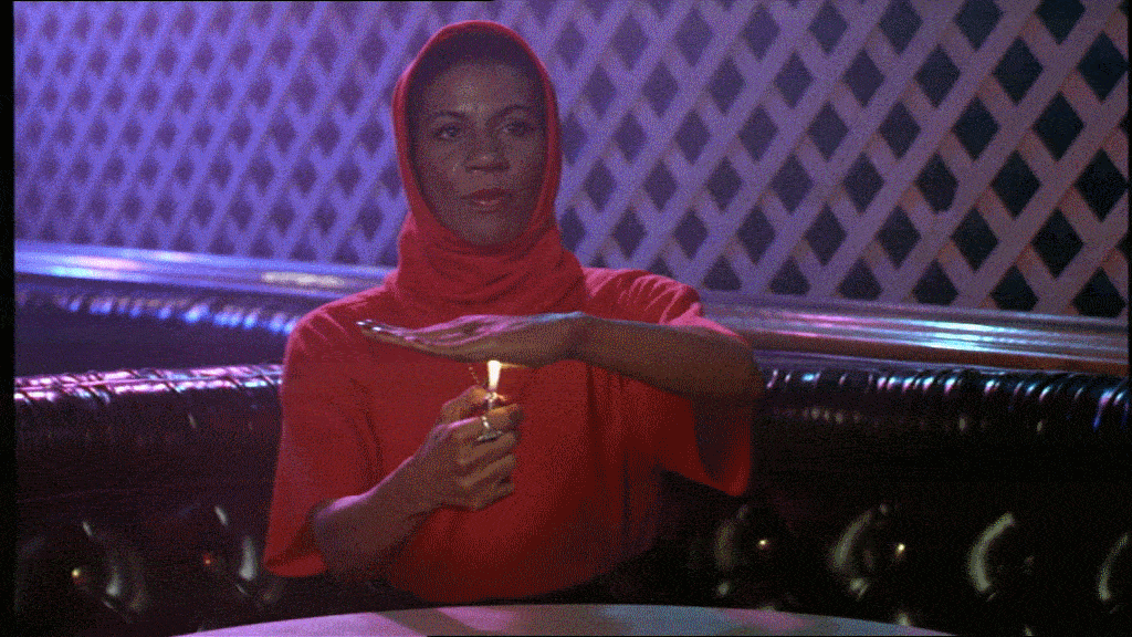 Woman lighting a lighter under her hand