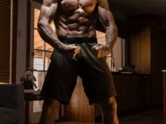 Very muscular man flexing to illustrate how to increase testosterone naturally