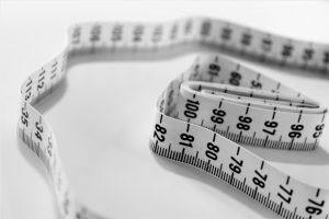 Image of a measuring tape to illustrate whyFasting For Women Is Not As Effective For Weight-Loss
