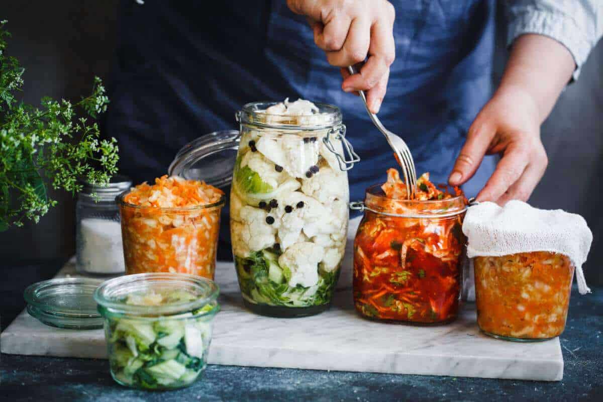 Fermented foods in glass jars on counter